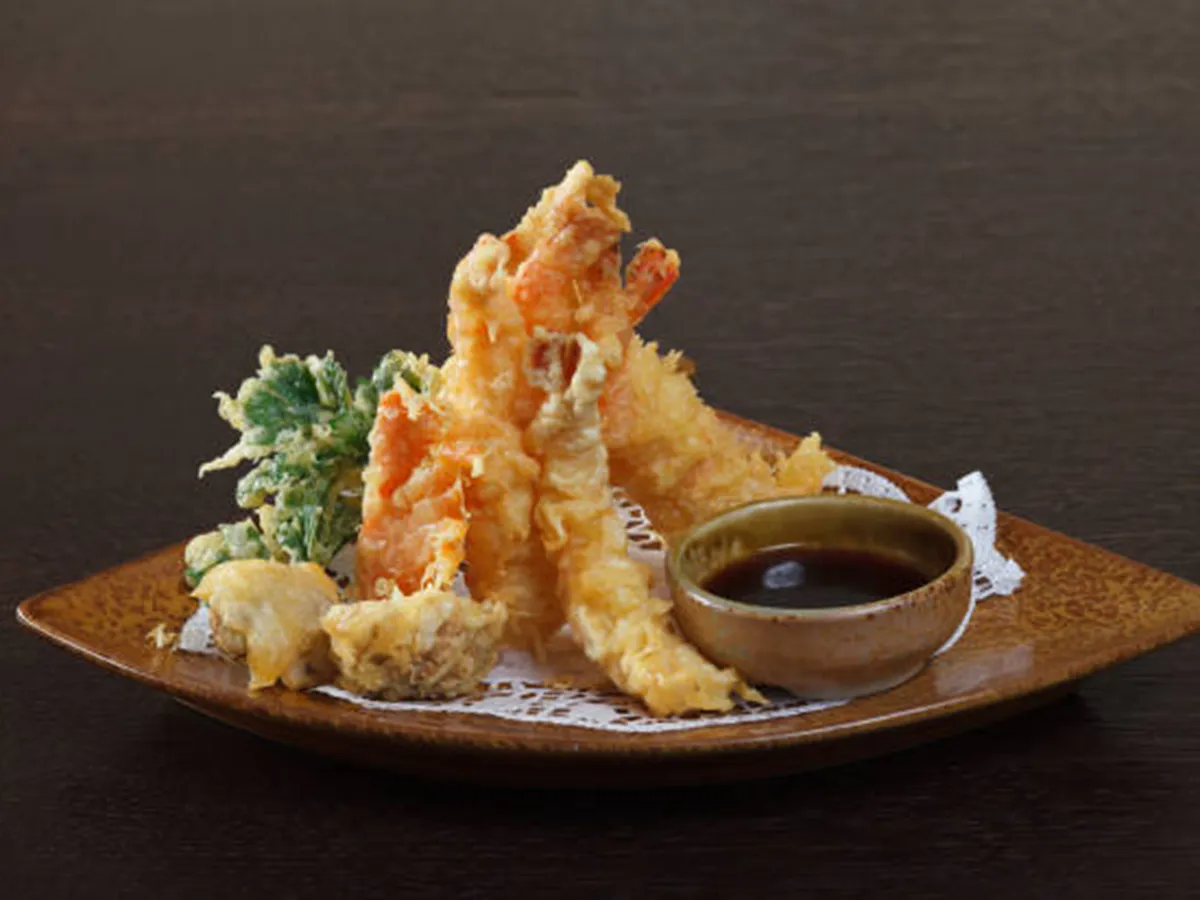 Tempura shrimps with soy sauce on wooden background at Sushi Kai, a Japanese Restaurant in Tallahassee