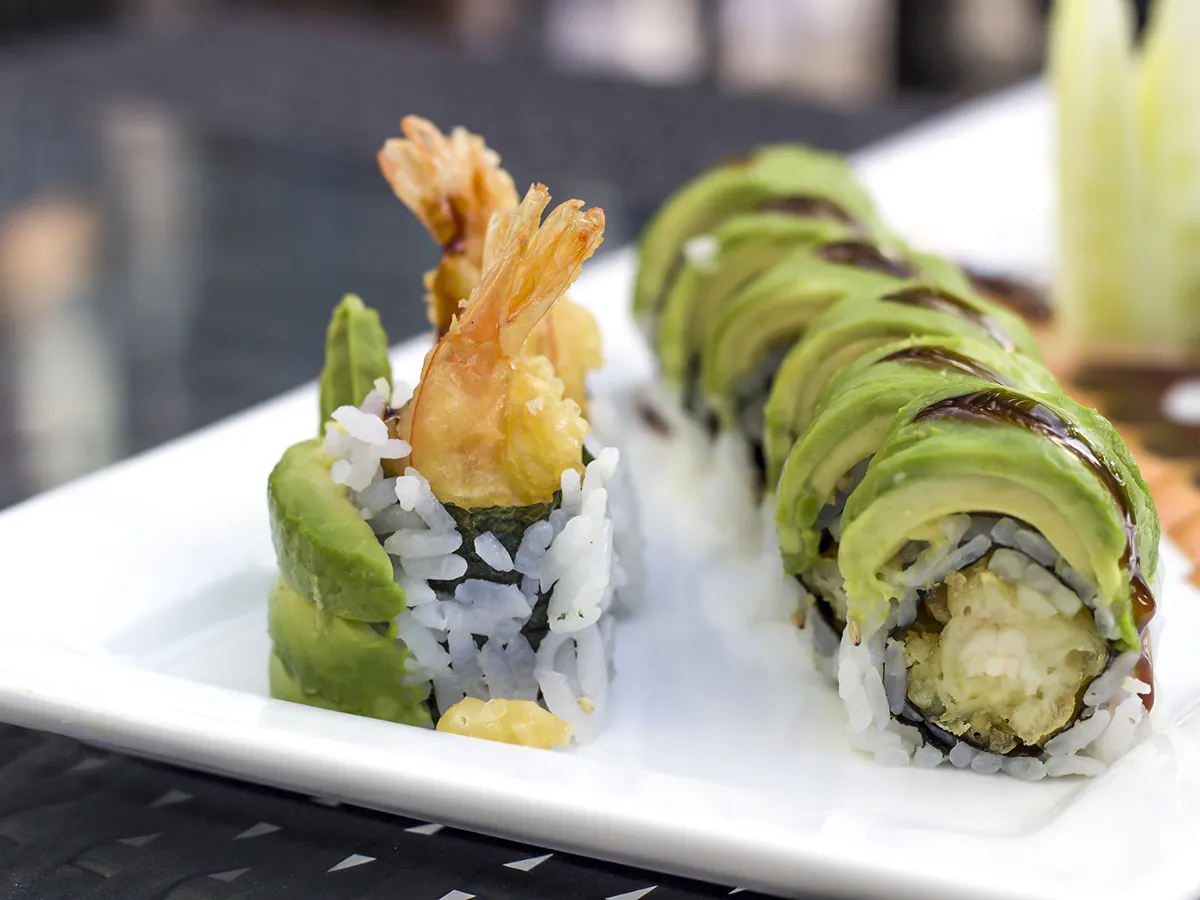 Tempura shrimp avocado sushi rolls on white plate at Sushi Kai, a Japanese Restaurant in Tallahassee